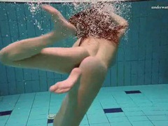 FuckCult presents: Underwater with a busty naked babe as she swims