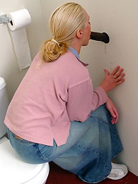 FuckCult presents: Blonde girl Jamie sits on the toilet and blows a black gloryhole dong